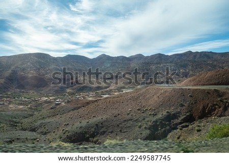 Panoramic view of the Atlas Mountains in Morocco and its curved roads to cross them