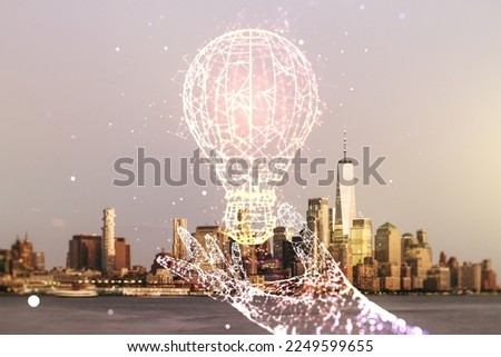 Abstract virtual light bulb hologram on Manhattan cityscape background, idea concept. Multiexposure