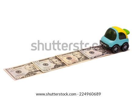 Toy car on money road isolated on white background 