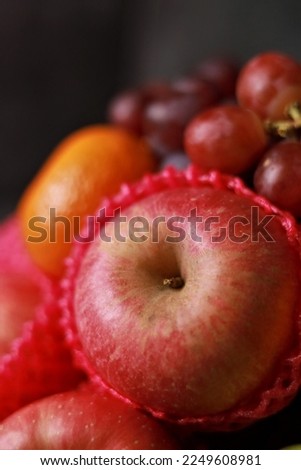 Raw Fresh Assorted Fruits Isolated Photo Contains Red Grapes, Red Apples, Green Pears, Oranges