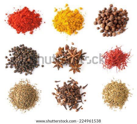 Set of spices (red and black pepper, allspice, saffron, curry, anise, cloves, cumin, coriander) isolated on white, top view Royalty-Free Stock Photo #224961538