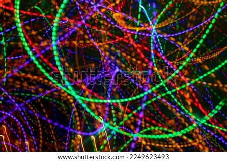 abstract colorful background of multicolored vivid streams of light