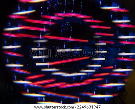 Abstract fractal prism creating an artistic composition of LED light tubes. RGB lights in artistic picture.