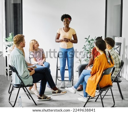 Group psychotherapy. Persons sitting in circle and talking. People meeting. Psychotherapy training, business lecture or conference. support group. meeting in the office