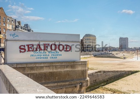 seafood sign buy the main beach at margate during a summer heat wave Royalty-Free Stock Photo #2249646583