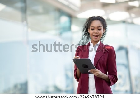 African american business woman with computer tablet pc in office district.