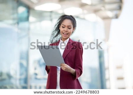 African american business woman with computer tablet pc in office district.