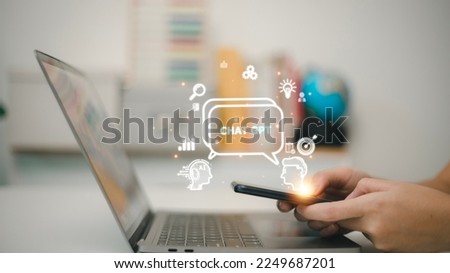 ChatGPT Chat with AI or Artificial Intelligence. woman chatting with a smart AI or artificial intelligence using an artificial intelligence chatbot developed by OpenAI. Royalty-Free Stock Photo #2249687201