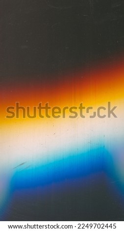 Dust scratches overlay. Light flare noise. Distressed texture. Orange blue white color glow defect dirt stains on dark black abstract copy space background.