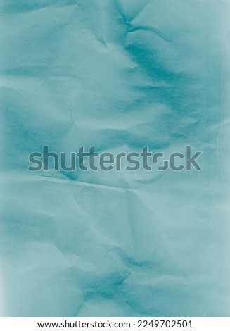 Creased paper texture. Distressed overlay. Wrinkled noise. Blue color grain dust scratches on light uneven rough abstract copy space background.