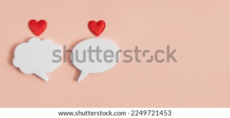 Chat icons with hearts on a light background. The concept of modern love. Valentine's Day. Long distance relationship. Online confession of love. Modern love. Copy space. Royalty-Free Stock Photo #2249721453
