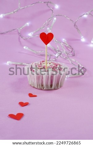 Template for valentine's day, birthday with cheesecake, red heart on lilac background, vertical picture with space for text at the bottom, garland and line of hearts
