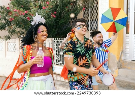 Brazilian Carnival. Group of friends celebrating carnival party Royalty-Free Stock Photo #2249730393