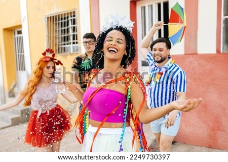 Brazilian Carnival. Group of friends celebrating carnival party Royalty-Free Stock Photo #2249730397