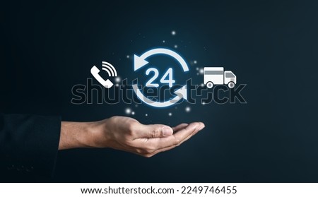 Nonstop service 24 hr of delivery e-commerce concept. businessman hand holding virtual 24-7 with clock on hand for worldwide nonstop and full-time available contact of service. customer service. Royalty-Free Stock Photo #2249746455