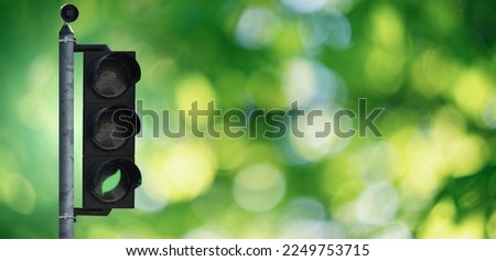 Traffic light with green leaf symbol. Clean mobility concept Royalty-Free Stock Photo #2249753715