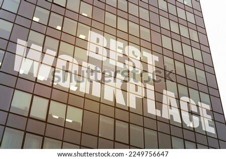 Business concept. On the glass surface of the business center there is an inscription - Best Workplace Royalty-Free Stock Photo #2249756647