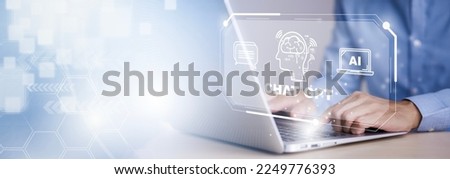 Man using Laptop or Smartphone With ChatGPT Chat with AI, Artificial Intelligence,System Artificial intelligence an artificial intelligence chatbot, Digital chatbot,robot application, conversation  Royalty-Free Stock Photo #2249776393