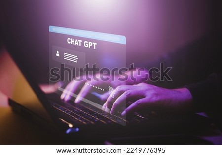 Man using Laptop or Smartphone With Chat GPT Chat with AI, Artificial Intelligence,System Artificial intelligence an artificial intelligence chatbot, Digital chatbot,robot application, conversation  Royalty-Free Stock Photo #2249776395