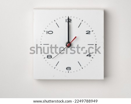 A wall clock isolated on white background. It is 12 o´clock.
 Royalty-Free Stock Photo #2249788949