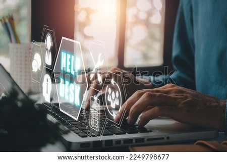 Communication Service Help Desk Concept, Person hand typing keyboard on office desk with Help desk icon on virtual screen. Royalty-Free Stock Photo #2249798677