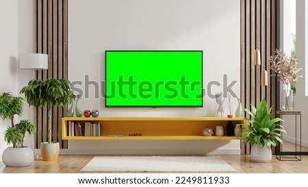 a room with a greenscreen tv to make it easier to compose material