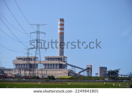 The view of a Steam Power Plant (PLTU), Batang Regency, Central Java, Indonesia. Royalty-Free Stock Photo #2249841805