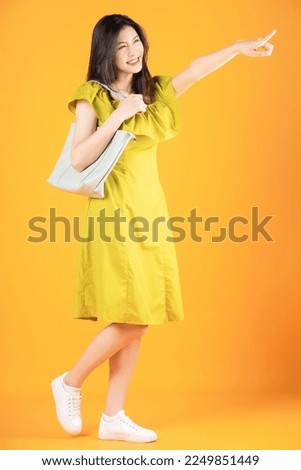 Image of beautiful young Asian woman on background