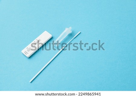 Home Antigen Test Kit virus covid-19 negative and positive, blue background, copy space Royalty-Free Stock Photo #2249865941