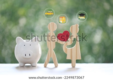 Love couple holding heart shape on natural green background,Save money for prepare in future and family finance concept