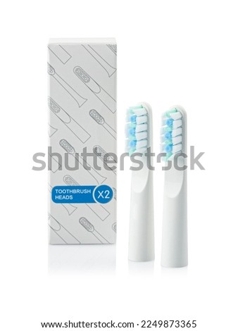 Replacement heads for a sonic electric toothbrush. Set of two with packaging. White background. Isolated.
