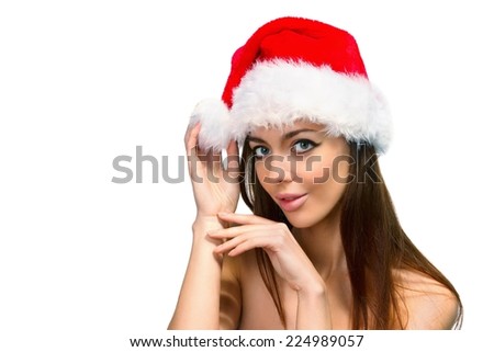 Beautiful girl in red hat of Santa, she is smiling, closeup, isolated on a white background