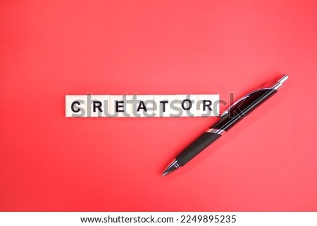 pen with the word creator. creator designer concept. create video or photographer content