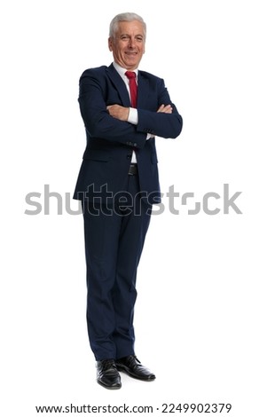 full body picture of a old businessman crossing his arms at chest