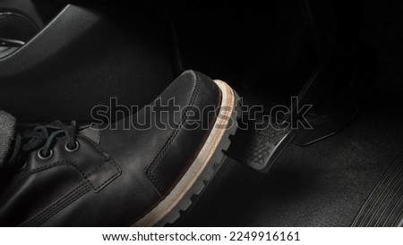 Car accelerate and brake foot pedal. Close up foot press or push foot break and accelerate pedal of a car to drive ahead. Driver driving the car by pressing or pushing accelerator pedals of the car. Royalty-Free Stock Photo #2249916161