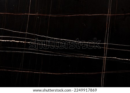 Sahara Noir Marble background, top texture for effect dark design look. Slab photo. Dark black matt material slate backdrop for exterior, luxury home decoration, 3d floor tiles, ceramic wall surface. Royalty-Free Stock Photo #2249917869