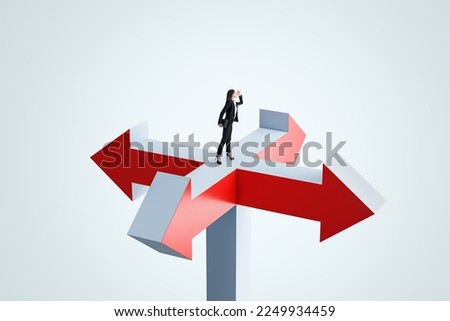 Looking for a solution and right decision concept with looking into the distance businesswoman staying on crossroads of red and grey arrows on abstract light background