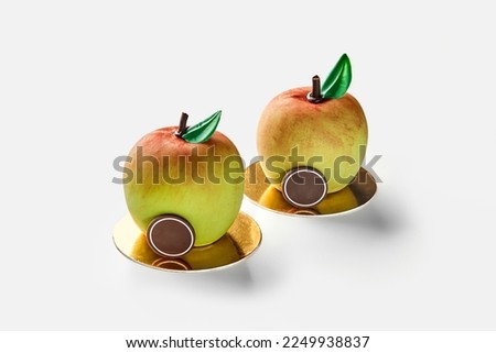 Apple shaped pastries on golden cardboard on white