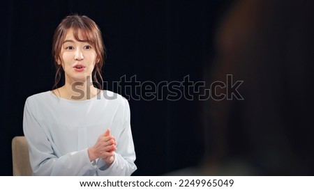 A woman being interviewed. documentary program. Royalty-Free Stock Photo #2249965049