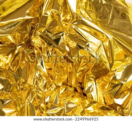 full frame creased gold foil background. High quality photo