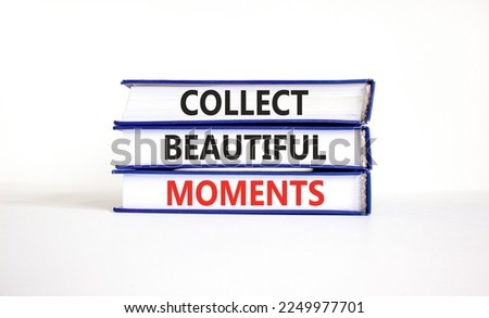 Collect beautiful moments symbol. Books with words 'Collect beautiful moments'. Beautiful white background. Business, collect beautiful moments concept, copy space.