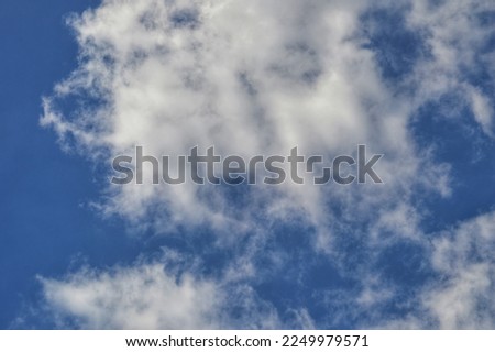 background of bright blue sky and white clouds during the day