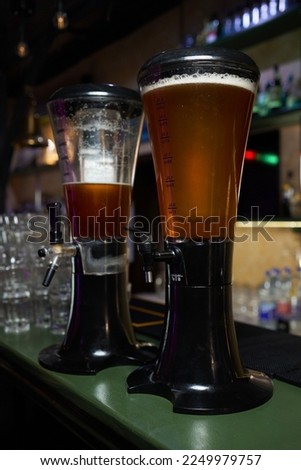 blur background closeup beer tower with bokeh at the night bar Royalty-Free Stock Photo #2249979757