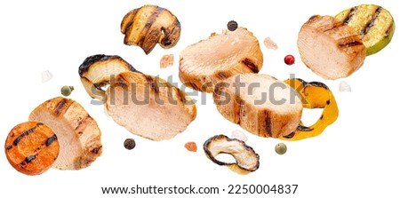 Grilled chicken slices and chopped vegetables isolated on white background Royalty-Free Stock Photo #2250004837