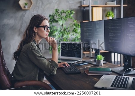 Profile side photo of smart focused minded lady solve work issue hacking sites upgrade program reboot system indoor room workstation