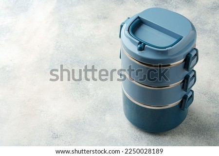 New plastic lunch box on a gray background
