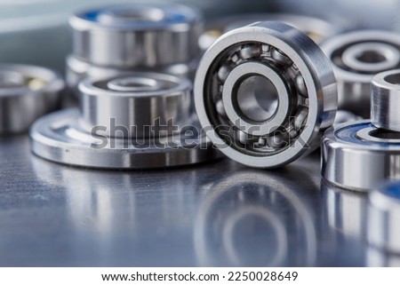 different bearings on a metal background. Part of mechanism. Royalty-Free Stock Photo #2250028649
