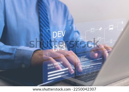 DevOps icon concept, software development, IT operations. Business man using laptop development with dev ops icon on computer screen, coder or sysadmin typing on keyboard, high software quality. Royalty-Free Stock Photo #2250042307