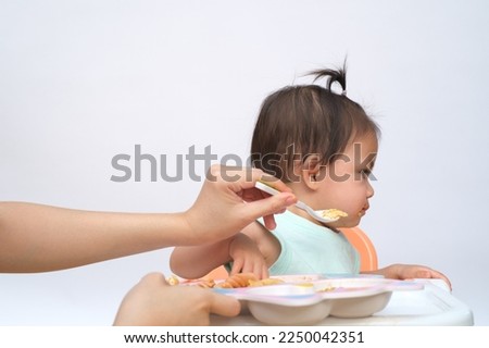 Nutrition healthy eating habits for kids concept. baby do not like to eat food. Little cute kid girl refuse unhappy and unlike to eat healthy food. Royalty-Free Stock Photo #2250042351