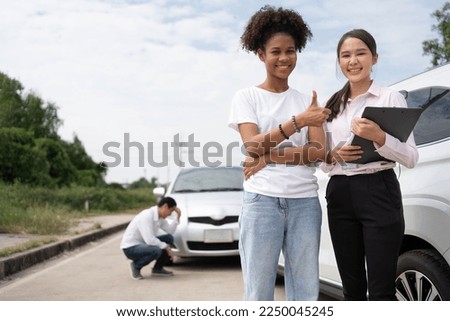 Women drivers Talk to Insurance Agent for examining damaged car and customer checks on the report claim form after an accident. Concept of insurance, advice auto repair shop and car traffic accidents. Royalty-Free Stock Photo #2250045245